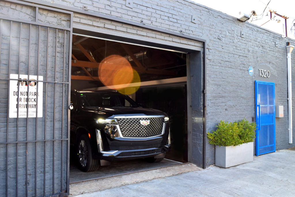 Cadillac Escalade Exiting MG Studio garage front grill