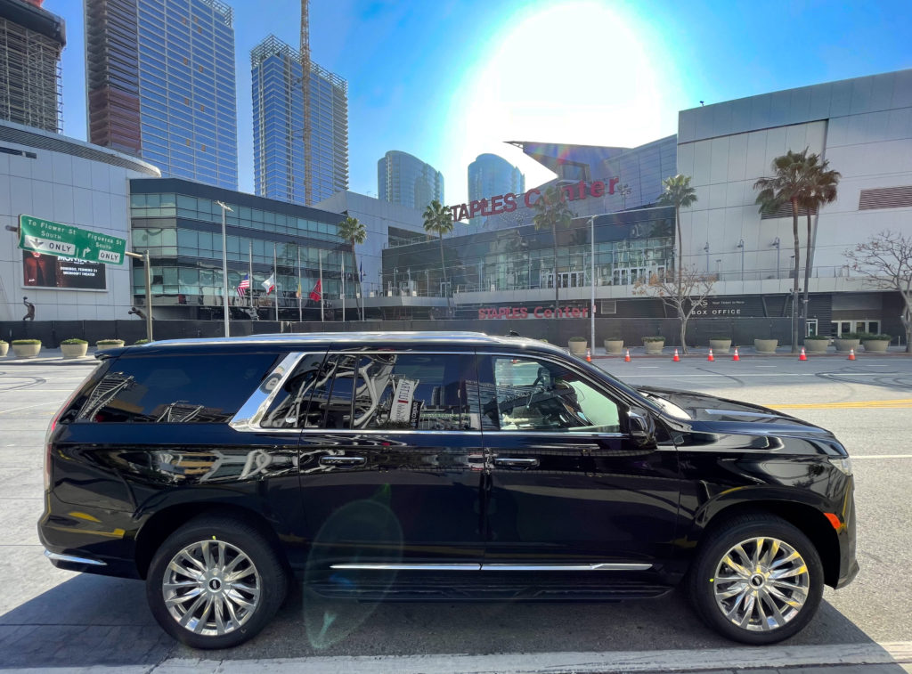 Cadillac Escalade Staples Center in background side view of luxury SUV