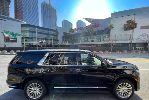 Cadillac Escalade Staples Center in background side view of luxury SUV