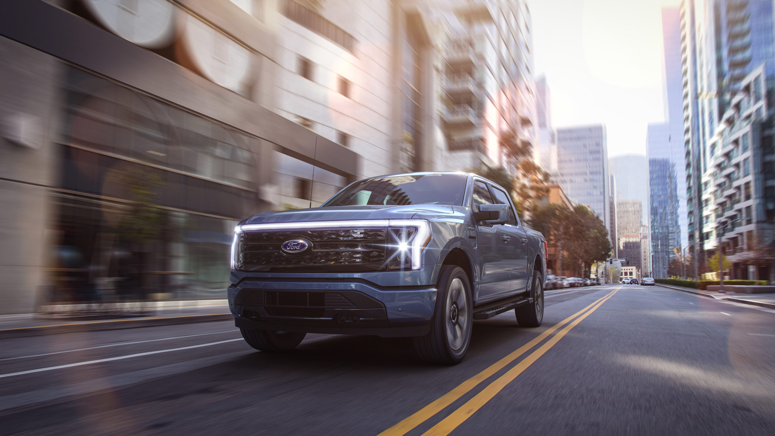 Ford F-150 Lightning driving down city street