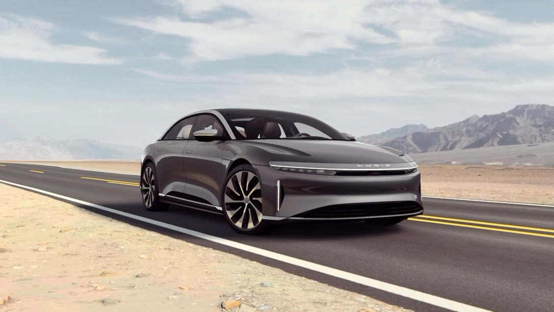 Lucid Air luxury EV sedan sports car driving in desert