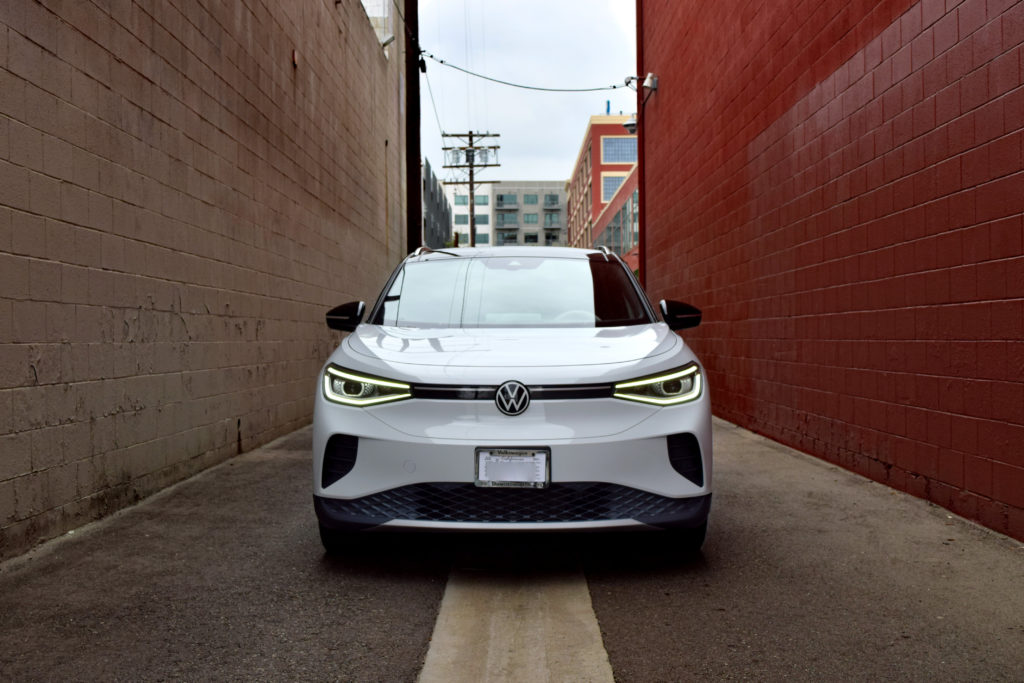 VW ID.4 white crossover front brown brick alley Los Angeles