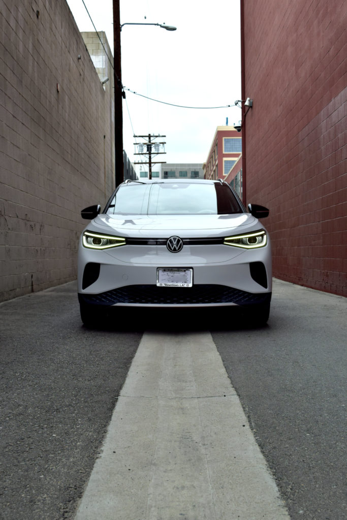 VW ID.4 front vertical in brown brick alley Los Angeles